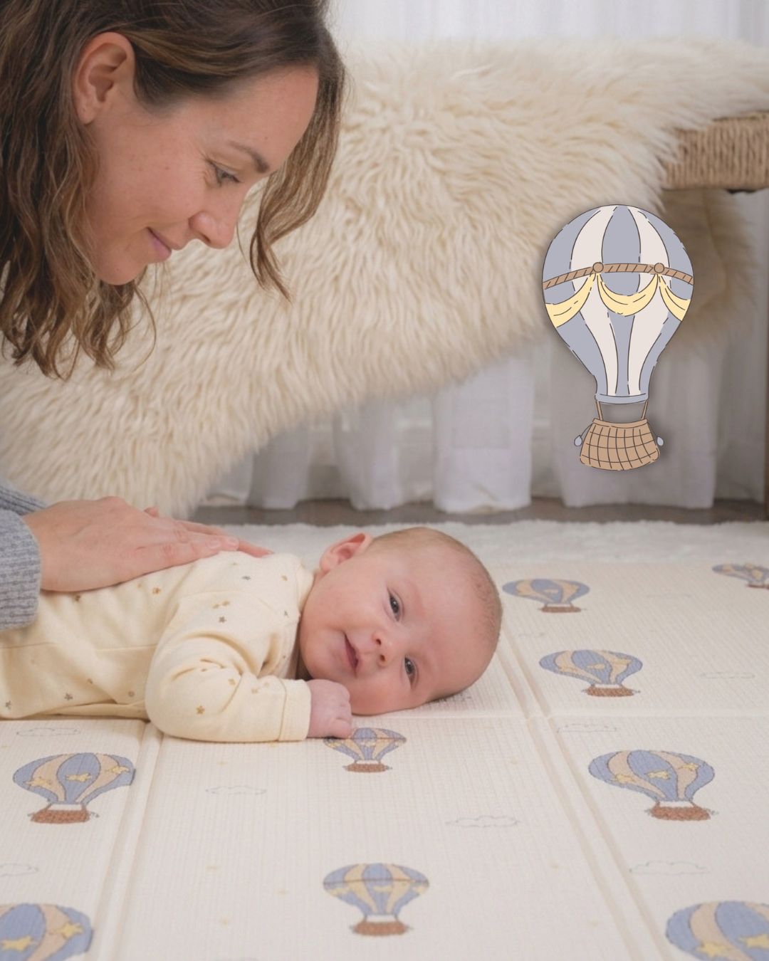 Baby enjoying tummy time on the Tiny Trees foldable play mat